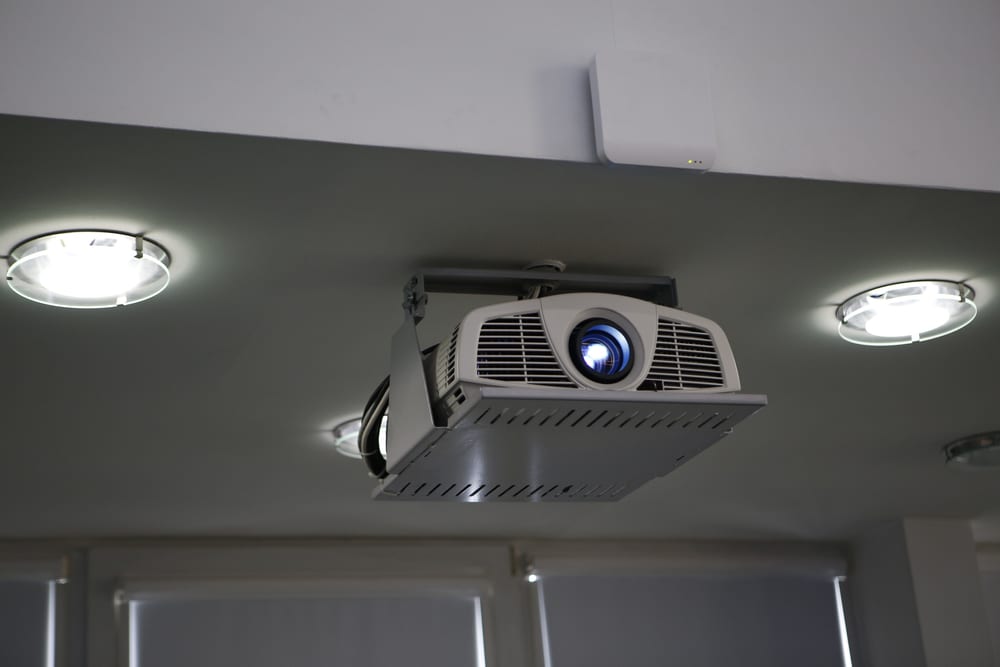 Stylish Modern Projector Mounted On The Ceiling In The Conference