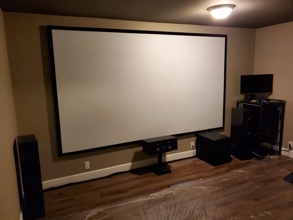 A projector screen at a home theatre