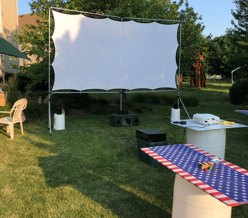 A view of a projector screen frame in an outdoor home garden