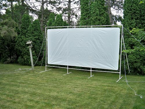 A view of an Outdoor Movie Projector with PVC Frame in a garden