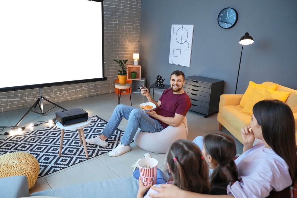 A view of a family watching projector screen