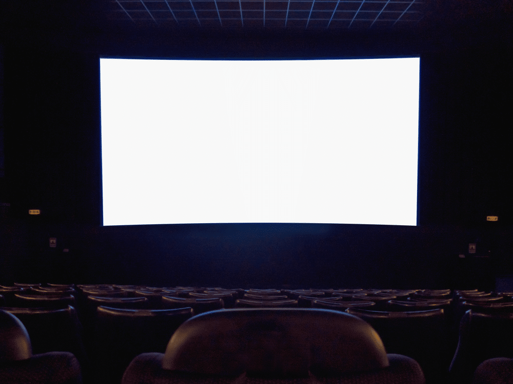 A view of a projector screen inside a theatre