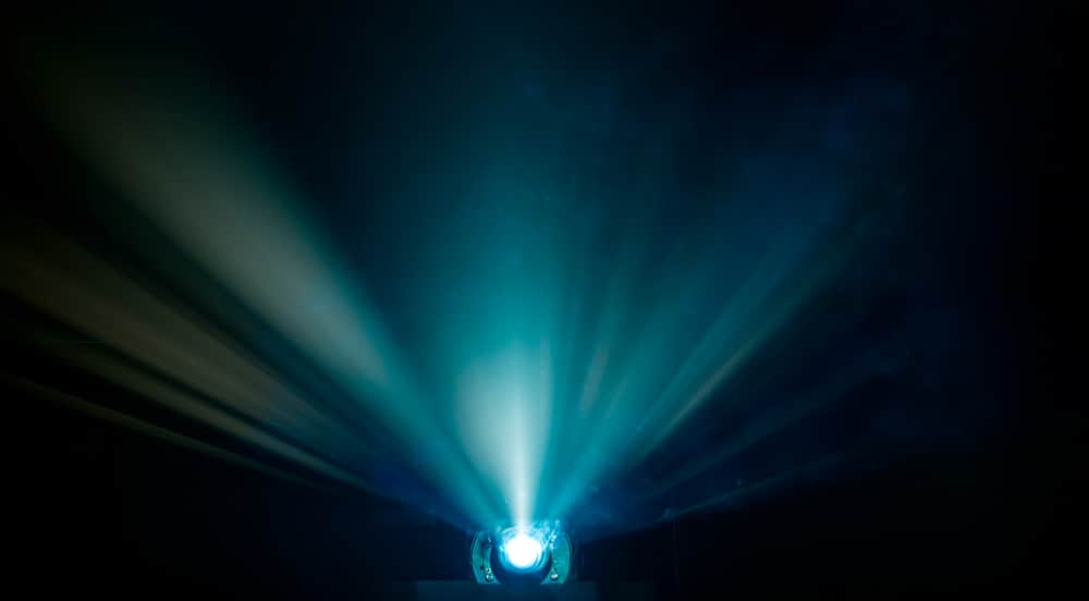 A view of rays of light coming out of a projector