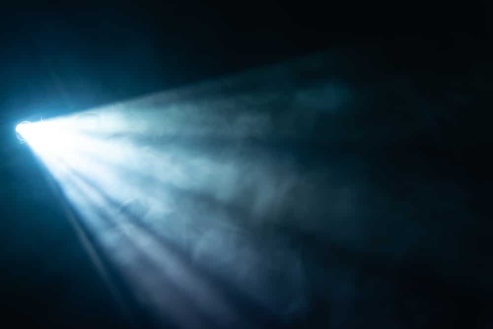 A view of a blue spotlight beam from a projector