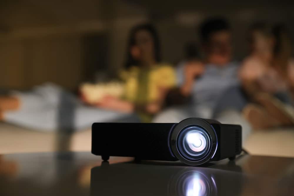 A front view of a projector throwing out light