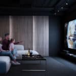 A view of a family watching television in the lounge