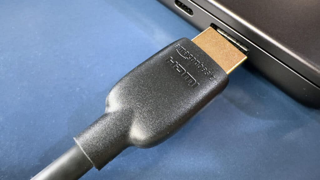 A view of an HDMI cable close to a laptop port A view of an HDMI cable close to a laptop port