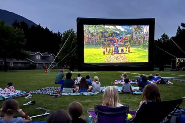 A view of an epic movie projector with people sitting all around