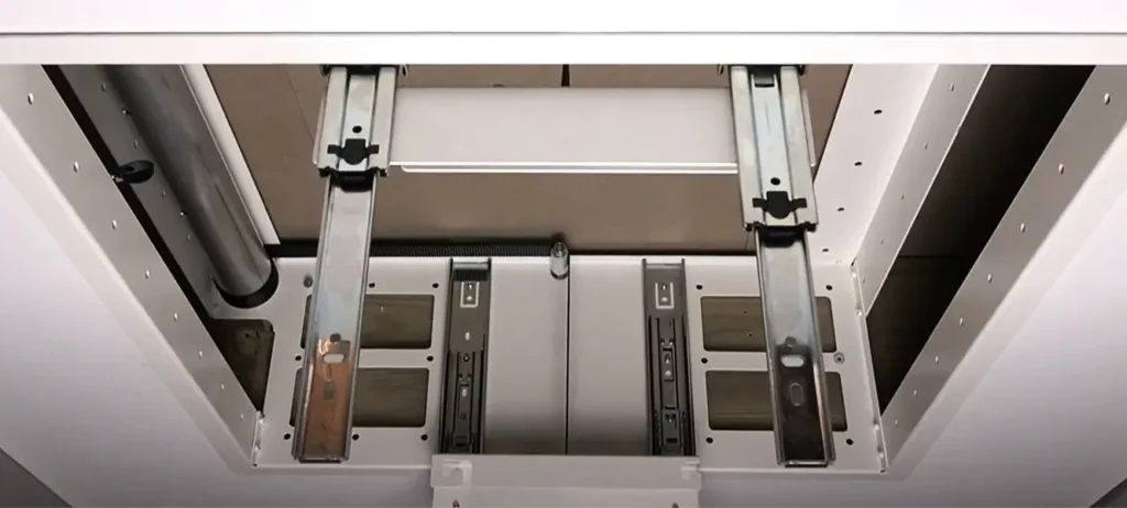 Close up of a projector lift system installation with rails for ceiling mounting