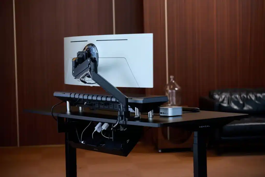 Modern desk setup with an adjustable monitor arm and tidy cable management